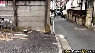 Asian relieves herself